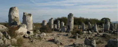 Tall limestone pillars in a desert-like landscape